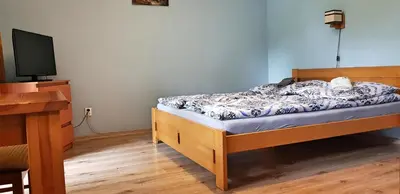 Łóżko lub łóżka w pokoju w obiekcie Willa Słoneczko