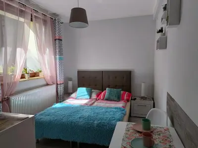 Łóżko lub łóżka w pokoju w obiekcie DOMEK Zielona Oaza