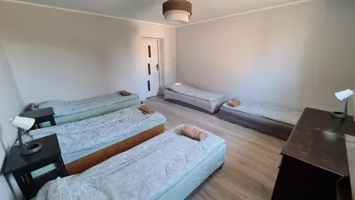 Łóżko lub łóżka w pokoju w obiekcie Urocze Apartamenty na Wsi