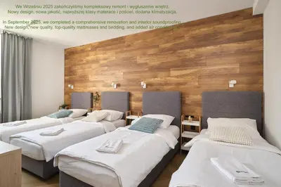 Łóżko lub łóżka w pokoju w obiekcie LeoApart Solny Square ApartHotel