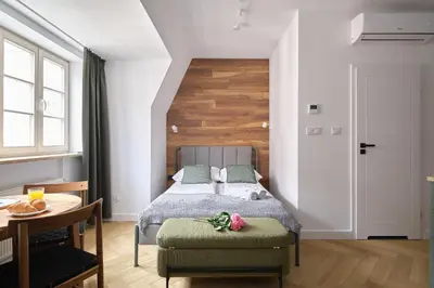 Łóżko lub łóżka w pokoju w obiekcie LeoApart Solny Square ApartHotel