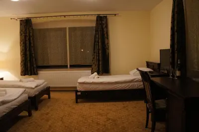 Łóżko lub łóżka w pokoju w obiekcie Dworska Elektrownia
