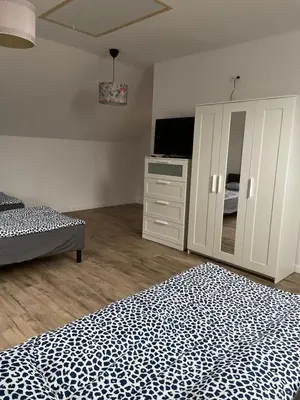 Łóżko lub łóżka w pokoju w obiekcie Hanuszówka pokoje gościnne z łazienkami