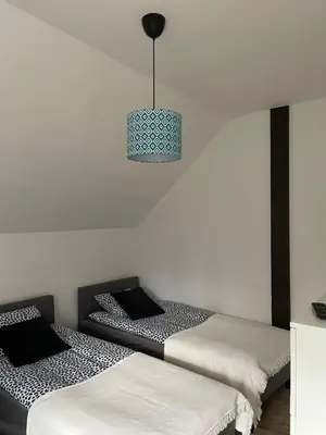 Łóżko lub łóżka w pokoju w obiekcie Hanuszówka pokoje gościnne z łazienkami