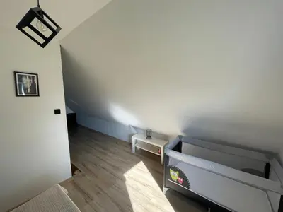 Łóżko lub łóżka w pokoju w obiekcie Domek nad Stawem