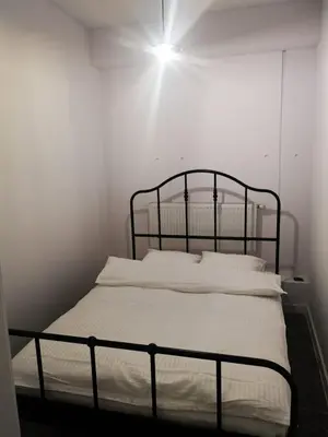 Łóżko lub łóżka w pokoju w obiekcie Apartamenty LENA 4