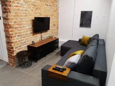 Telewizja i/lub zestaw kina domowego w obiekcie Apartamenty LENA 4