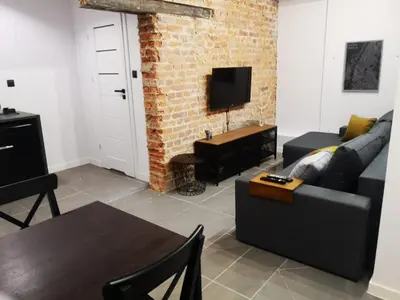 Telewizja i/lub zestaw kina domowego w obiekcie Apartamenty LENA 4