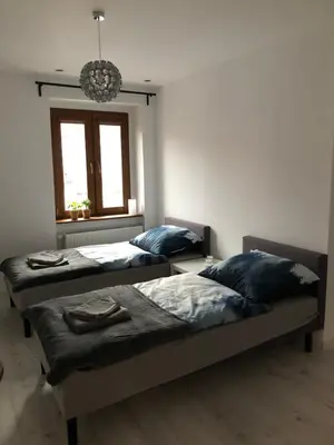 Łóżko lub łóżka w pokoju w obiekcie Apartament Lux-centrum