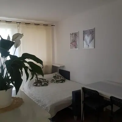 Łóżko lub łóżka w pokoju w obiekcie krynicka