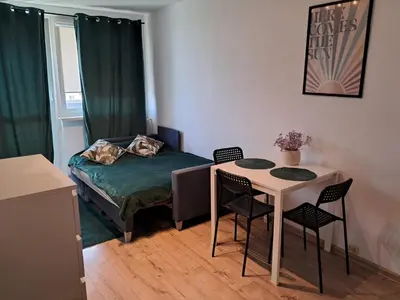 Łóżko lub łóżka w pokoju w obiekcie krynicka