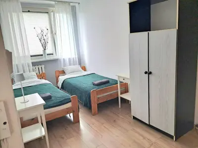 Łóżko lub łóżka w pokoju w obiekcie krynicka