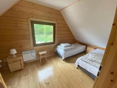 Łóżko lub łóżka w pokoju w obiekcie DOMKI W CHMURACH