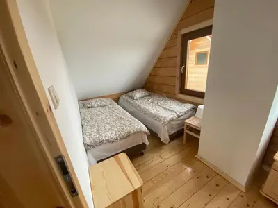 Łóżko lub łóżka w pokoju w obiekcie DOMKI W CHMURACH