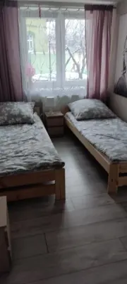 Łóżko lub łóżka w pokoju w obiekcie POD BZEM