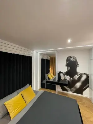 Łóżko lub łóżka w pokoju w obiekcie Apartamenty Manhattan