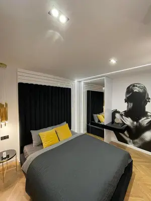 Łóżko lub łóżka w pokoju w obiekcie Apartamenty Manhattan