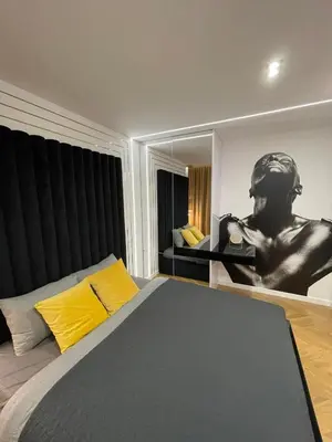 Łóżko lub łóżka w pokoju w obiekcie Apartamenty Manhattan