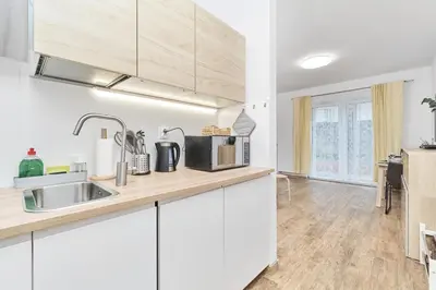 Kuchnia lub aneks kuchenny w obiekcie Riverside Apartments Na Grobli by Noclegi Renters