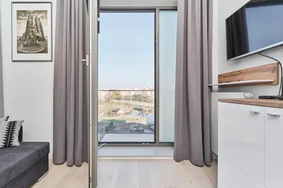 Telewizja i/lub zestaw kina domowego w obiekcie Eleganckie Studia Wyspa Słodowa by Noclegi Renters
