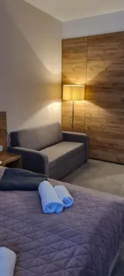 Łóżko lub łóżka w pokoju w obiekcie Aparthotel Apartamenty Czarna Góra 310