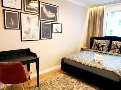 Łóżko lub łóżka w pokoju w obiekcie Apartament Braniborska