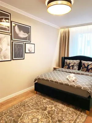 Łóżko lub łóżka w pokoju w obiekcie Apartament Braniborska