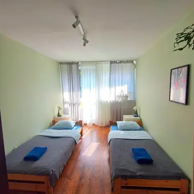 Łóżko lub łóżka w pokoju w obiekcie Jelenia