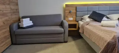 Łóżko lub łóżka w pokoju w obiekcie Aparthotel Apartamenty Czarna Góra 330
