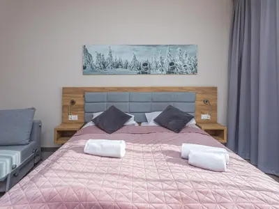 Łóżko lub łóżka w pokoju w obiekcie Aparthotel Apartamenty Czarna Góra 331