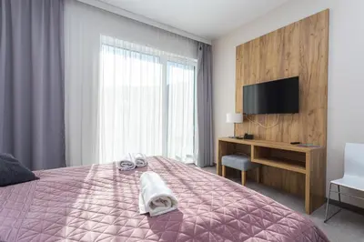 Łóżko lub łóżka w pokoju w obiekcie Aparthotel Apartamenty Czarna Góra 331