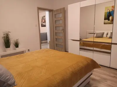 Łóżko lub łóżka w pokoju w obiekcie Apartament Marzenie 2 - Opole