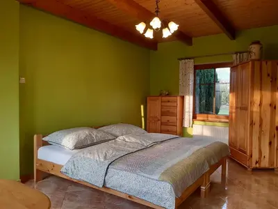Łóżko lub łóżka w pokoju w obiekcie Agroturystyka Tam Gdzie Sosny