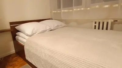 Łóżko lub łóżka w pokoju w obiekcie DROINVEST Mieszkanie 2-pokojowe - Apartament Wrocław Inżynierska