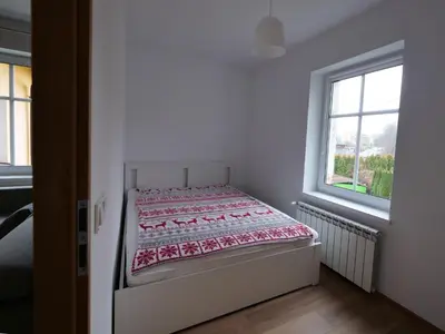 Łóżko lub łóżka w pokoju w obiekcie Apartamenty Kościuszki