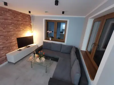 Telewizja i/lub zestaw kina domowego w obiekcie Na Jedwabnej