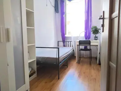 Łóżko lub łóżka w pokoju w obiekcie Stilo Dom - Plac Świętego Macieja