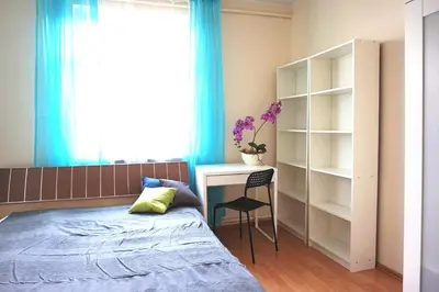 Łóżko lub łóżka w pokoju w obiekcie Stilo Dom - Plac Świętego Macieja
