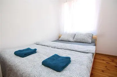 Łóżko lub łóżka w pokoju w obiekcie Stilo Dom - Plac Świętego Macieja