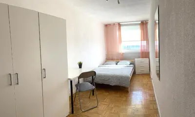 Łóżko lub łóżka w pokoju w obiekcie Noclegi - ul Śliczna