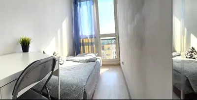 Łóżko lub łóżka w pokoju w obiekcie Noclegi - ul Śliczna