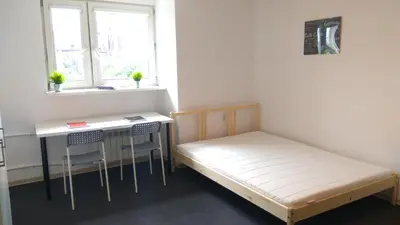 Łóżko lub łóżka w pokoju w obiekcie Stilo Dom - ul Nowowiejska