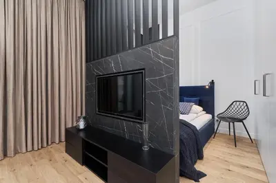 Łóżko lub łóżka w pokoju w obiekcie Apartments Młyn Maria Wrocław by Noclegi Renters