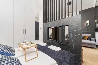 Łóżko lub łóżka w pokoju w obiekcie Apartments Młyn Maria Wrocław by Noclegi Renters