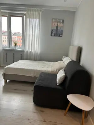 Łóżko lub łóżka w pokoju w obiekcie Apartament na Dworcowej Centrum Parking Gratis