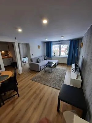 Łóżko lub łóżka w pokoju w obiekcie Orlicka Apartament