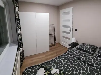 Łóżko lub łóżka w pokoju w obiekcie Orlicka Apartament