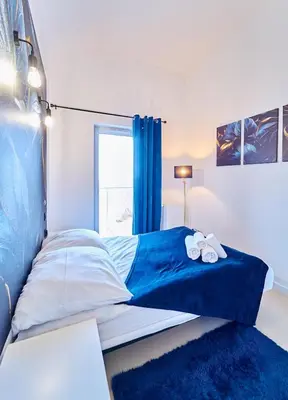 Łóżko lub łóżka w pokoju w obiekcie LAGUNA Apartament Polanica Residence 59 z klimatyzacją
