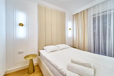 Łóżko lub łóżka w pokoju w obiekcie LAGUNA Apartament Polanica Residence 20