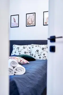 Łóżko lub łóżka w pokoju w obiekcie LAGUNA Apartament Polanica Residence 5